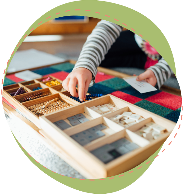 A child playing with wooden blocks on the floor.