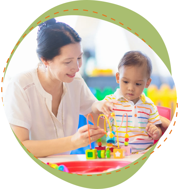 A woman and child playing with blocks in a room.