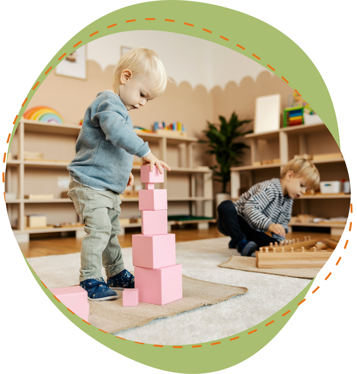 A young child playing with blocks in a room.