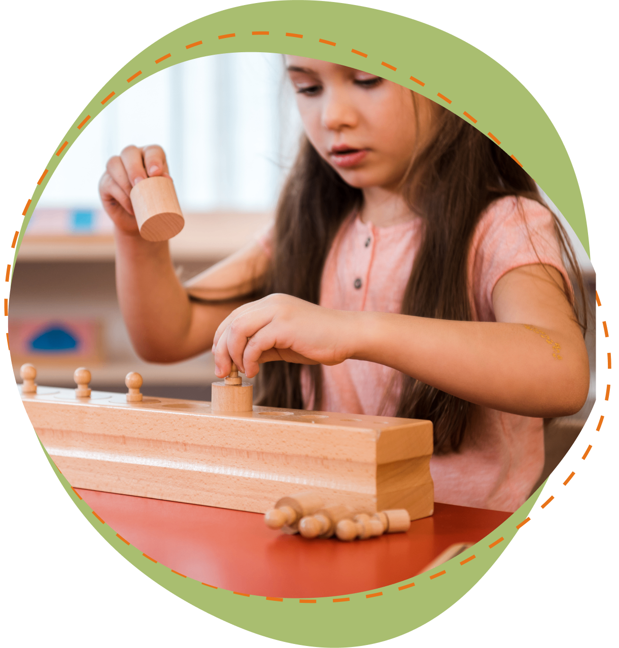 A girl is playing with wooden toys